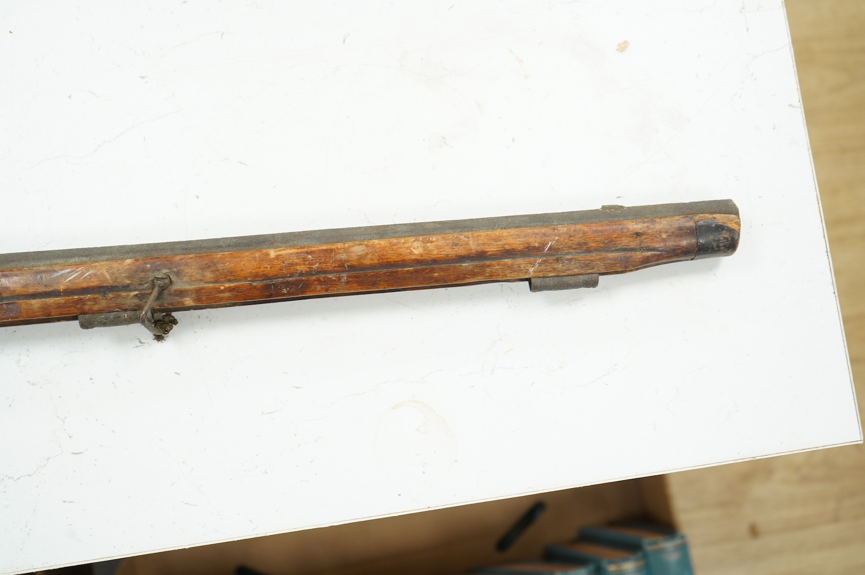 A 32 bore Continental flintlock rifle, unsigned lock, (cock missing) iron mounts and fully stocked, chequered small, sliding patch box cover, (ramrod missing)